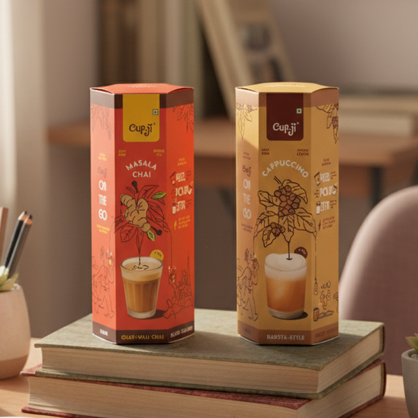 Box of chai and coffee on a desk with stationery items